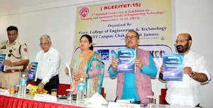 DyCM, Dr Nirmal Singh, Minister for Social Welfare, Bali Bhagat and other dignitaries unveiling a book during NCEEITET-2015 at GCET, Jammu on Tuesday.