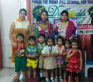 Winners of Poem Recitation competition posing for a group photograph at Daffodils Care Convent School in Jammu. 