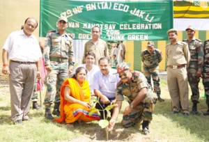 Army and Forest officers planting trees.