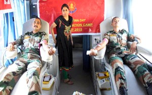 Armymen donating blood during a camp organised by Crossed Swords Division at Akhnoor on Monday.