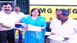 DDC, Sheetal Nanda presenting seed kit to a farmer on Wednesday.