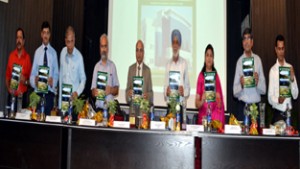 Dignitaries releasing abstract book of conference in the inaugural of two-day seminar at JU on Monday.