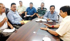 MoS Finance, Pawan Gupta chairing a meeting at Udhampur on Monday.