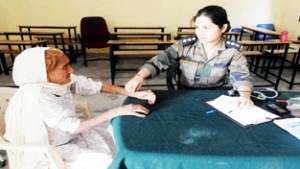 Doctor examining a patient during medical camp at Seri Palai.