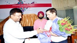 JKGB Chairman, RK Chhibber and others during a financial literacy workshop on e-payment at Jammu.