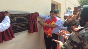 MoS Finance Pawan Gupta inaugurating a community hall on Saturday.
