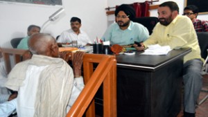 DC Simrandeep Singh listening to a farmer during Tehsil Divas at Arnia.