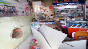 Mobile shop which was looted on Saturday. —Excelsior/Younis Khaliq