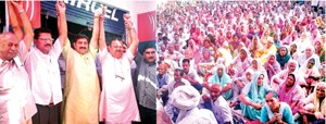 Minister for Industries, Chander Parkash Ganga flanked by MP Jugal Kishore Sharma at public gathering at Vijaypur on Sunday.