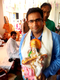 A youth who qualified civil services examination (IAS) recently posing for a photograph after being honoured at a function at Jammu on Sunday.