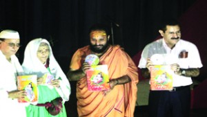 Translation of Bhagwat Puran being released at a function at Jammu on Sunday. -Excelsior/Rakesh
