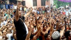 PHE workers staging protest demonstration outside Chief Engineer's office on BC Road in Jammu on Wednesday. -Excelsior/Rakesh 