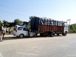 A car which rammed into a truck on Jammu-Pathankot National Highway near Ghagwal on Friday. -Excelsior/Gautam