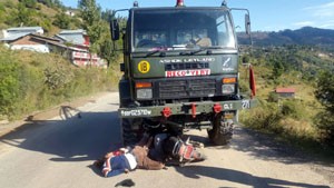 Bodies lying on road after collision of motorcycle with Army vehicle near Kud on Monday.
