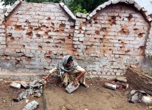 Walls of a house bearing testimony of unprecedented shelling from Pakistani Rangers in village Mawa in Samba sector on Sunday. -Excelsior/Rakesh