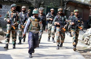 Troops in action during encounter in Kunzar area of Tangmarg on Wednesday. -Excelsior/Aabid Nabi