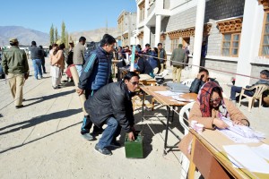 Election duty staff outside a polling booth in Leh on Friday.— Excelsior/Stenzin