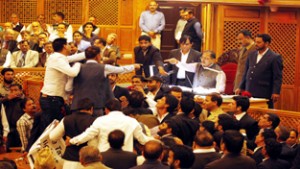 MLAs protesting atop table exchange words with Speaker Kavinder Gupta in the Assembly on Monday. -Excelsior/Amin War