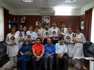 Winners of Inter-Collegiate competitions posing for a group photograph alongwith dignitaries during felicitation function at GDC Kathua.