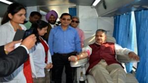 Prof Ashok Aima, VC CUJ donating blood during a camp on Wednesday.
