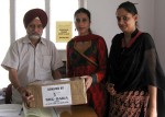 Dr Deedar Singh (MO), receiving medicines from NGO,  SARA members for Guru Nanak Mission Hospital, in Jammu on Saturday.