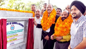 Minister for Rural Development, Abdul Haq Khan flanked by Minister for Forests Bali Bhagat laying foundation stone of works at Jammu on Saturday.