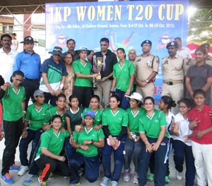 Triumphant players of Jammu Greens XI posing for a group photograph alongwith IGP Jammu, Danesh Rana in Jammu on Monday.