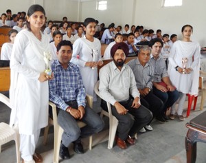 Winners of symposium posing alongwith dignitaries at GDC Billawar. 