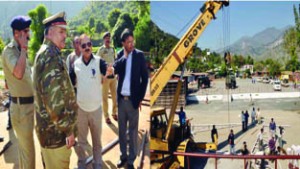 Divisional Commissioner Dr Pawan Kotwal reviewing arrangements for PM’s visit at Baglihar.