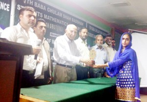 Winner of a competition being awarded during students conference at BGSBU on Friday.