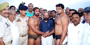Bali Bhagat, Minister for Social Welfare felicitating wrestlers in Jammu on Saturday.