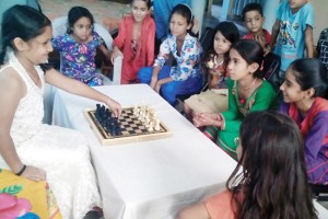 Players being coached by young Chess champion and ambassador of CSCA, Shivanshi in Jammu.