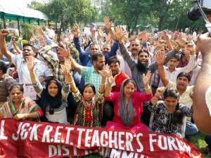 ReT teachers protesting in front of Directorate of School Education at Jammu on Monday.
