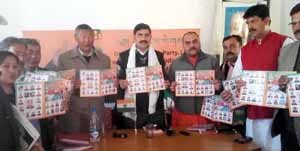 BJP leaders releasing special edition of party’s update at Leh on Saturday.  -Excelsior/Stenzin