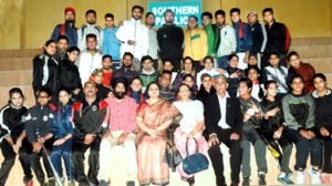 J&K Softball contingent posing alongwith Minister of State for Education, Priya Sethi and other dignitaries during flag off ceremony in Jammu on Sunday.