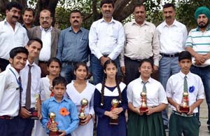Winners of painting competition posing for a group photograph.