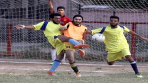 Footballers fighting for getting hold of the ball at GGM Science College football ground in Jammu. —Excelsior/Rakesh