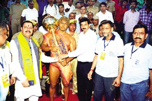 MoS Finance, Pawan Gupta felicitating winner of 11th Rustam-e-International Wrestling contest at Katra on Sunday.