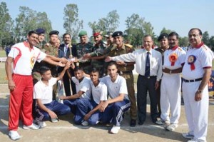 Winners of Sahodaya Athletics Trophy posing for a group photograph alongwith chief guest at Sainik School Nagrota on Wednesday.  