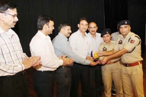 Mementoes and trophies being presented during concluding function of symposium in SKPA, Udhampur.