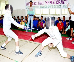 Fencers in action during Reasi District Fencing Championship on Wednesday. 