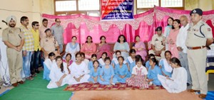 Chairperson and members of PWWA posing with visually impaired girls of Blind School Roop Nagar on Thursday.