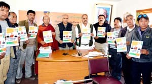 BJP leaders releasing poll manifesto for LAHDC, Leh on Thursday.-Excelsior/Stenzin