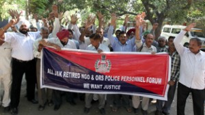 Retired police personnel raising slogans during protest at Jammu on Monday. -Excelsior/ Rakesh