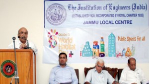 Er P K Nanda presenting his paper on World Habitat Day celebration function at Jammu on Monday.