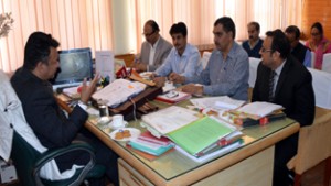Minister for Consumer Affairs Choudhary Zulfkar chairing a meeting at Srinagar on Saturday.