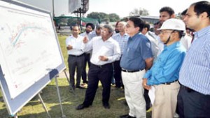 CEO ERA, Vinod Sharma inspecting work on flyover project in Jammu on Saturday.