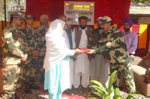 Family members of BSF martyrs being felicitated by a senior officer during a function at Khanetar in Poonch on Wednesday.