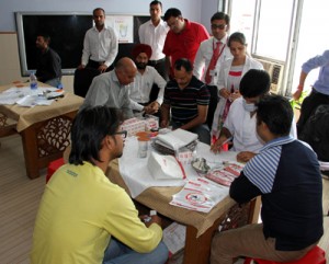 Team of doctors examining journalists during a Dental Check-up camp at Press Club Jammu on Tuesday.