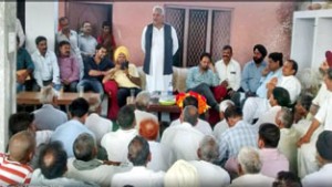 MLA Sham Choudhary addressing a gathering at village Bispur Parlah on Sunday.